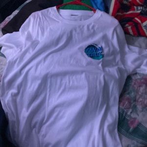 This is a Santa Cruz teeshirt white and with waves with the logo